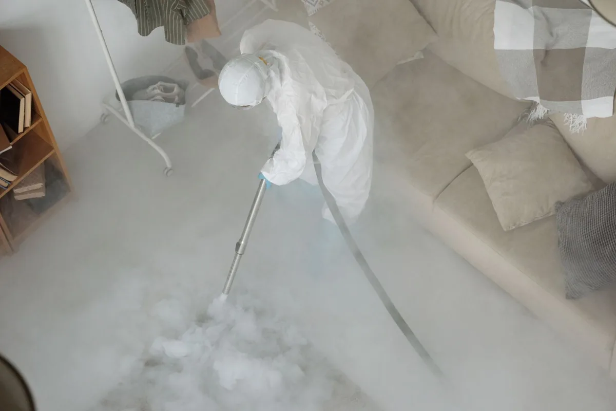 Biohazard cleanup technician in protective equipment, Bay Springs, MS